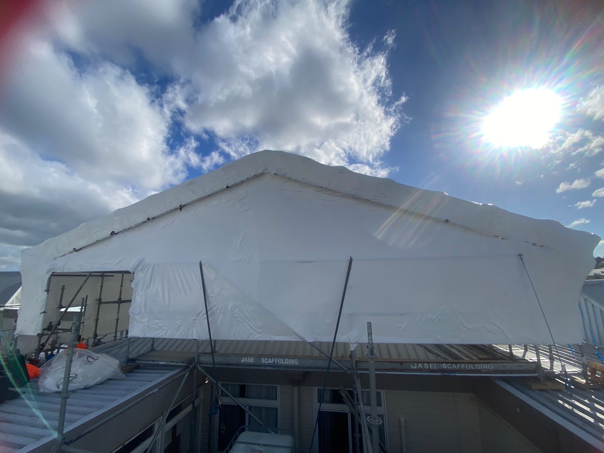 Jase Scaffolding shrink-wrap project with scaffolding around a residential building